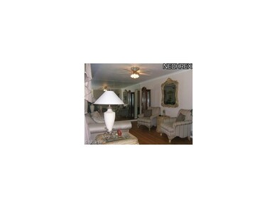 Formal living room with gleaming hardwood floors!
