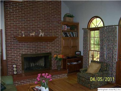 Great room with lovely arched windows and wood bur