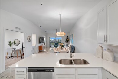 Kitchen with dishwasher, vaulted ceiling, sink, wh