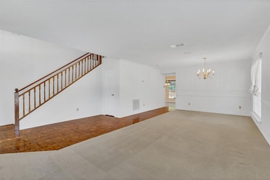 Living and dining rooms with teak parquet flooring