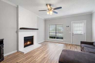 Living room with light wood-type flooring, ceiling