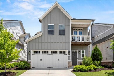 Craftsman house with board and batten siding, driv
