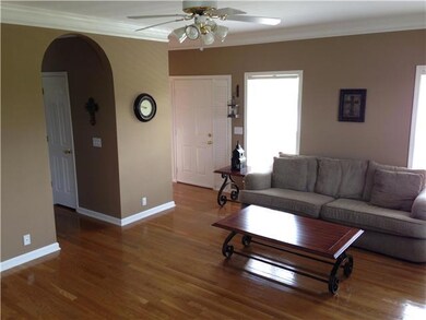 Nice open living room with wonderful light from all the many windows. 