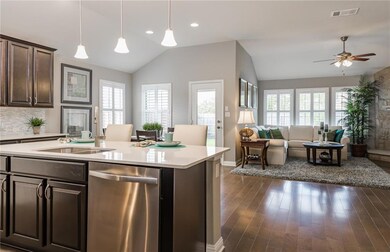Island kitchen overlooking gathering room - *Photo