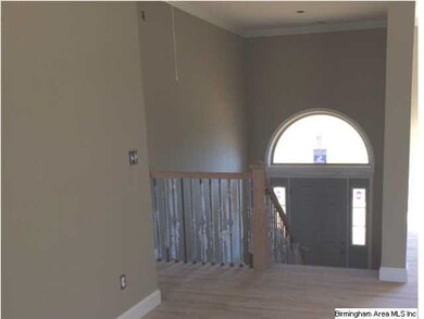 Iron along the staircase, beautiful arched door ca