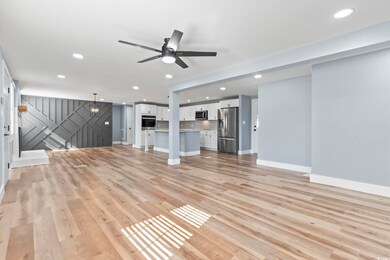 Unfurnished living room with light hardwood / wood