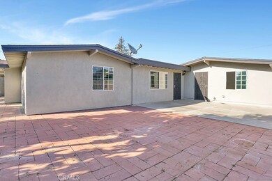Extra large paved side yard with a direct access to your garage and access to your secondary family room. Imagine... adding a very large Alumawood patio cover for an inviting outdoor living space.