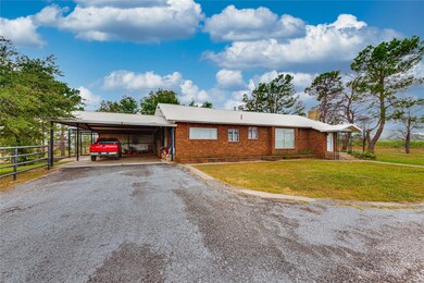 View of front of home featuring brick siding, an a