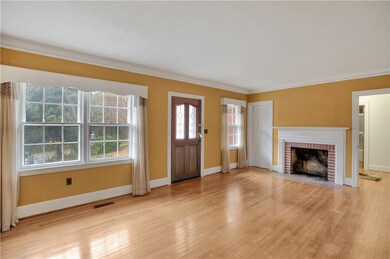Front entry living room  with masonry fireplace.