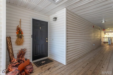 Entrance to property featuring a deck