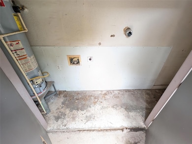 Washroom featuring electric dryer hookup, gas wat