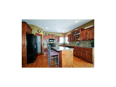Kitchen Close-up with Corner Walk-in Pantry.  Refr