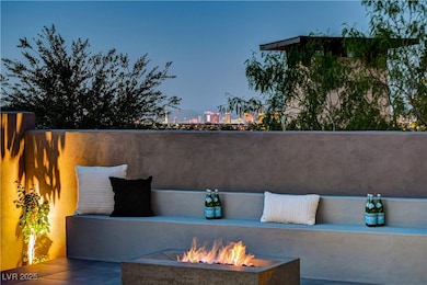 Raised patio with fire-pit & strip view