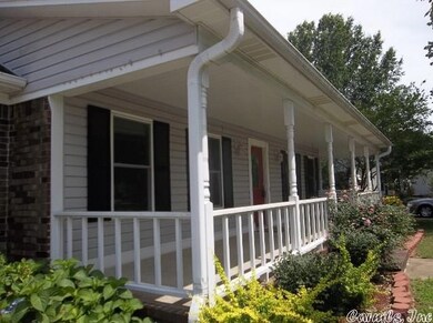 Country Front Porch & Beautiful Landscaping!