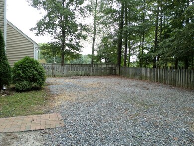 Large driveway and completely fenced yard!