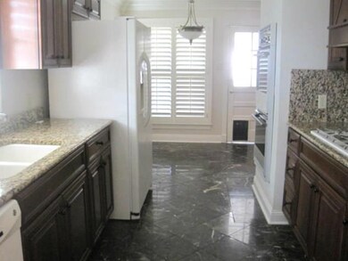 Kitchen w/ view of bkft area