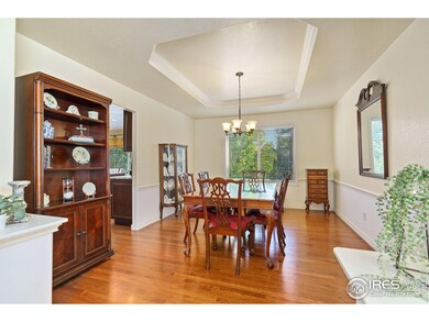 Formal dining room features coffered ceilings