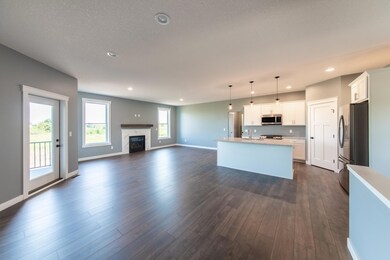 Photo of previous model - Gas fireplace with either tile or stone accents and mantel.