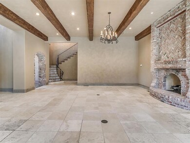 Living room featuring light tile floors, a firepla