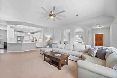 Updated kitchen opens into the living room.