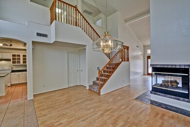 WOOD FLOORS AND PENNINSULA FIREPLACE.