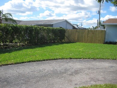 Other side yard with a cement slab can house camper or boat. The fence is new.
