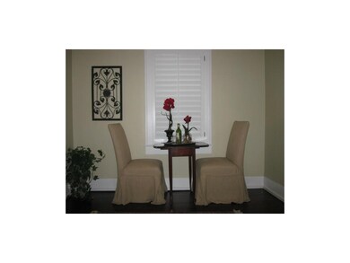 Cozy dining or can suit a larger table and chairs 