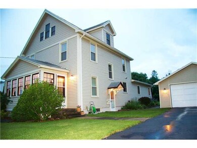 Exterior Front. Enclosed front porch and side entr