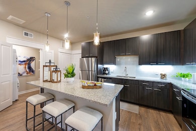 Kitchen - this is the furnished model, not actual unit, photo is for reference only