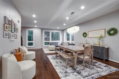 Dining space featuring dark wood-type flooring, re