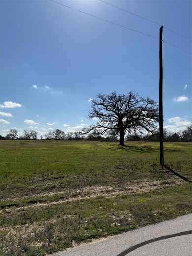 View of yard with a rural view