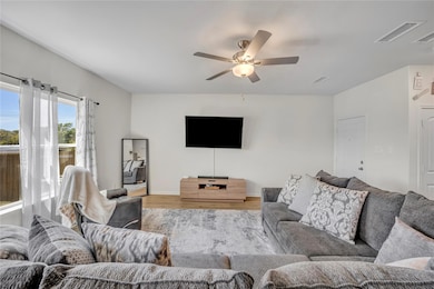 Living room featuring light wood-style flooring, v
