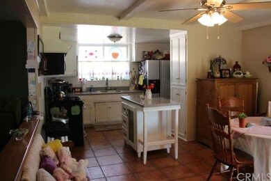 Open Kitchen with view of Living Room on the left 