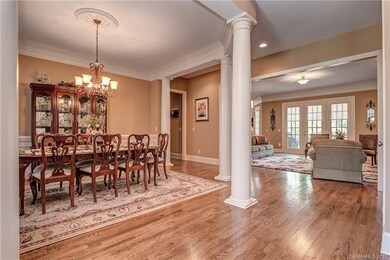Formal Dining Room with Hardwood Floors, Crown Mol