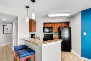 Kitchen with a kitchen breakfast bar, pendant ligh