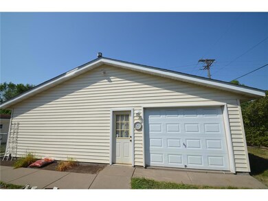 An additional door on the backside of the garage m