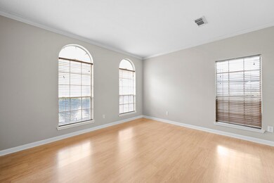 View of the formal living room, featuring crown mo