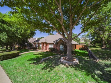 Single story home featuring a front lawn