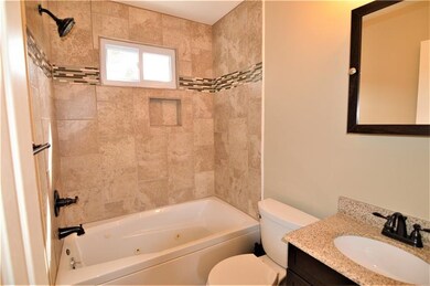 A view of the updated 1st floor bathroom with tile