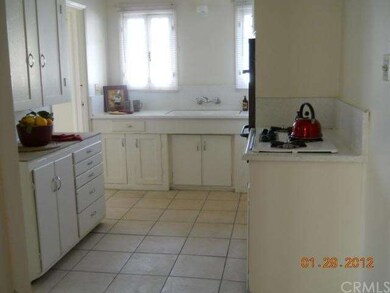 Large sunny kitchen updated with ceramic tile floo