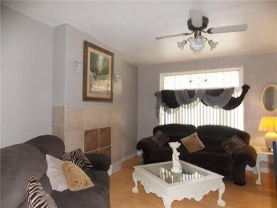 Living room features large picture window with dec