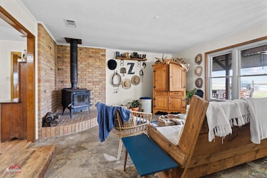 Living room featuring a textured ceiling, visible 