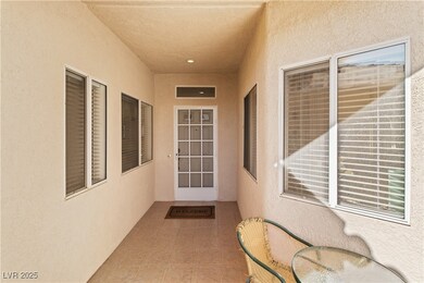 View of exterior entry featuring stucco siding