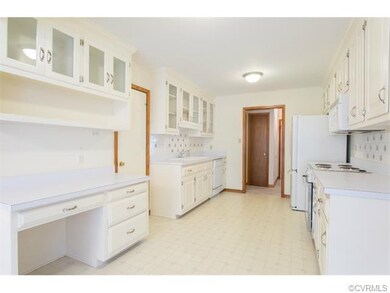 Kitchen has built in dishwasher,  electric range, 