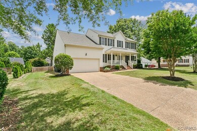 View of front facade with a porch, a garage, and a