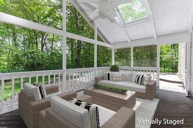 Screened in porch overlooking pool.