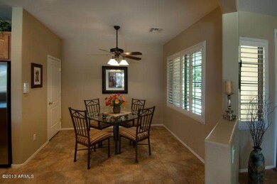 Breakfast nook w/ ceiling fan.