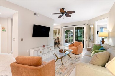 Tiled living room featuring ceiling fan