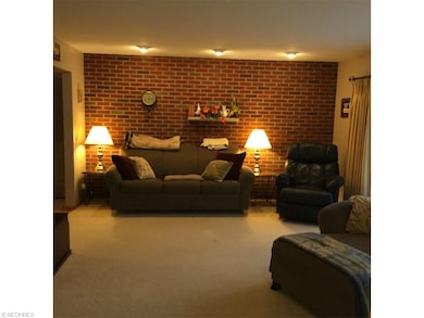 large living room with brick accent wall
