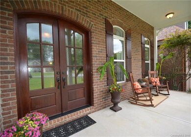 This charming covered front porch welcomes you to 